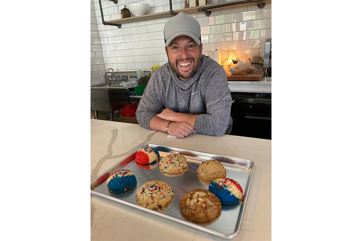 Laughing Horse owner, Mike, posing with cookies