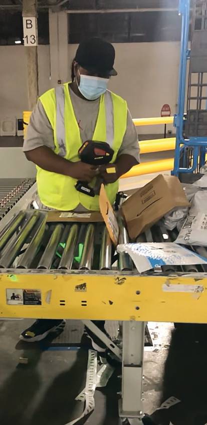 Local nonprofit VISIONS helps Westchester residents with visual impairments find work. The two workers above are employed at an Amazon warehouse.