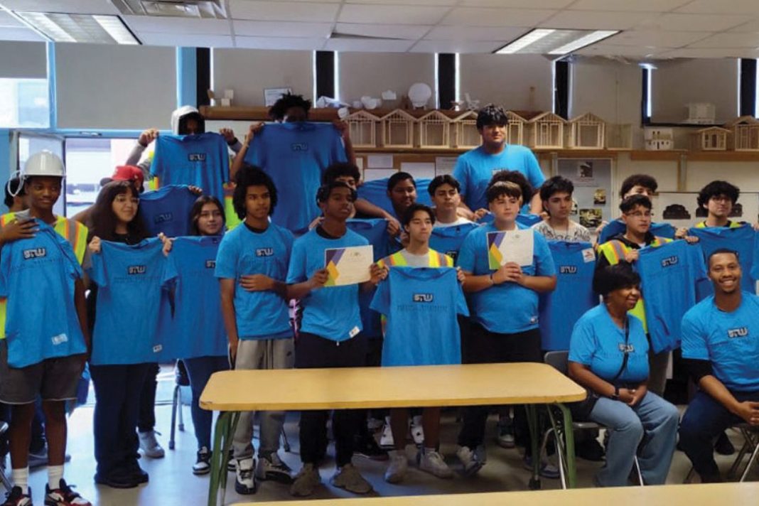 Students from New Rochelle High School participate in an end-of-program ceremony.