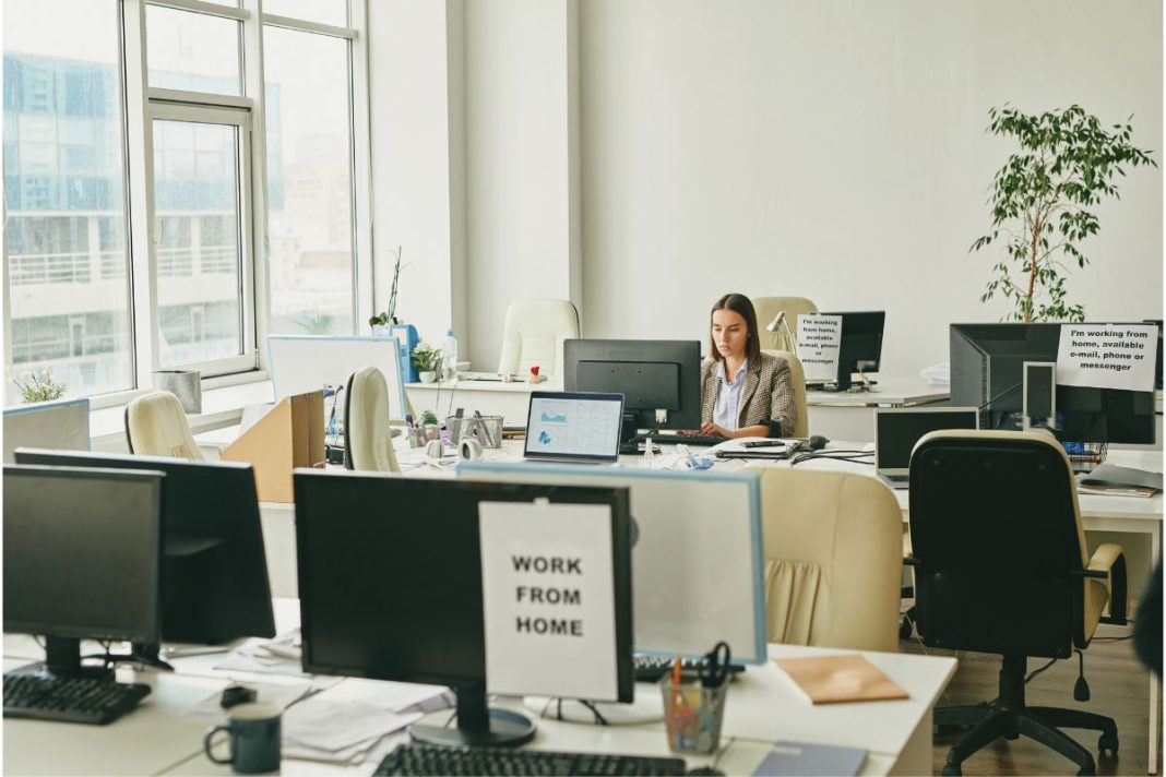 A woman working in an empty office